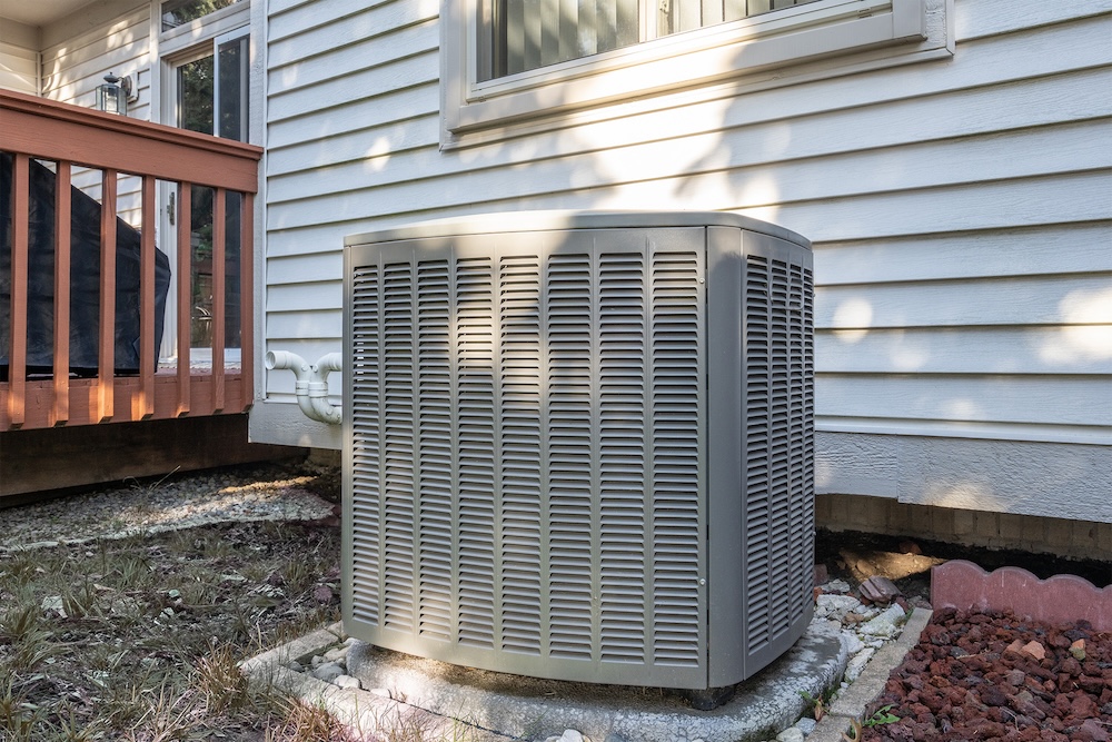 New Heater/ condenser unit installed outside a Panama City FL home